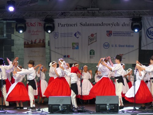 Traditional dance and pop music fills the air. 